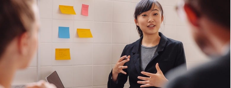 female-executive-explaining-new-business-idea-to-colleagues-picture-id607281552