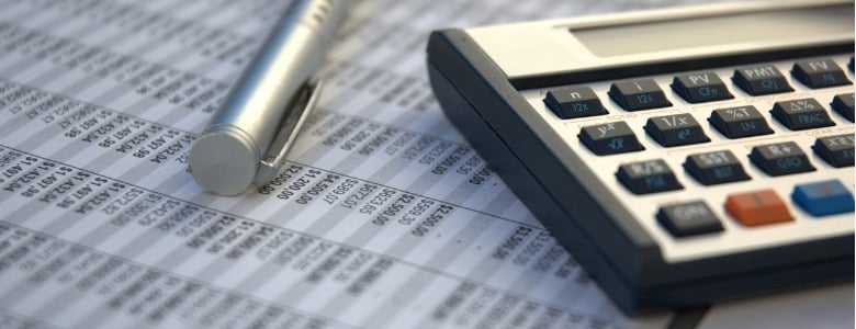financial-calculator-pen-reading-glasses-financial-books-picture-id179294506
